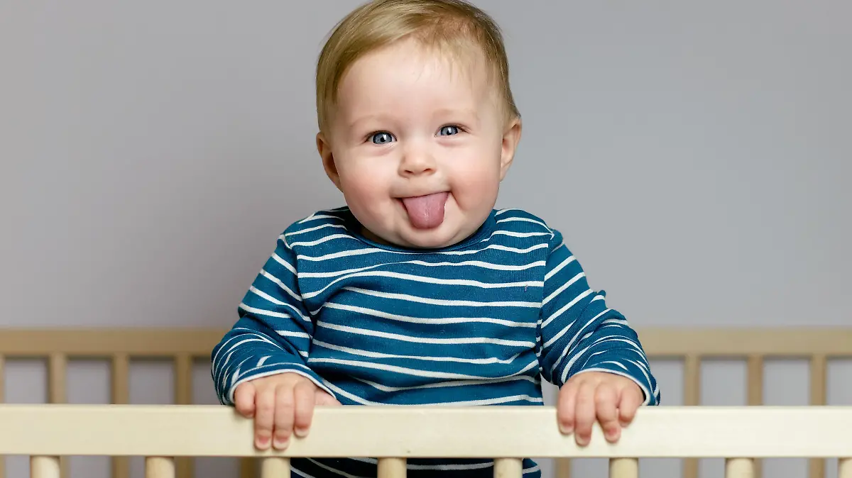 Baby playing in the crib