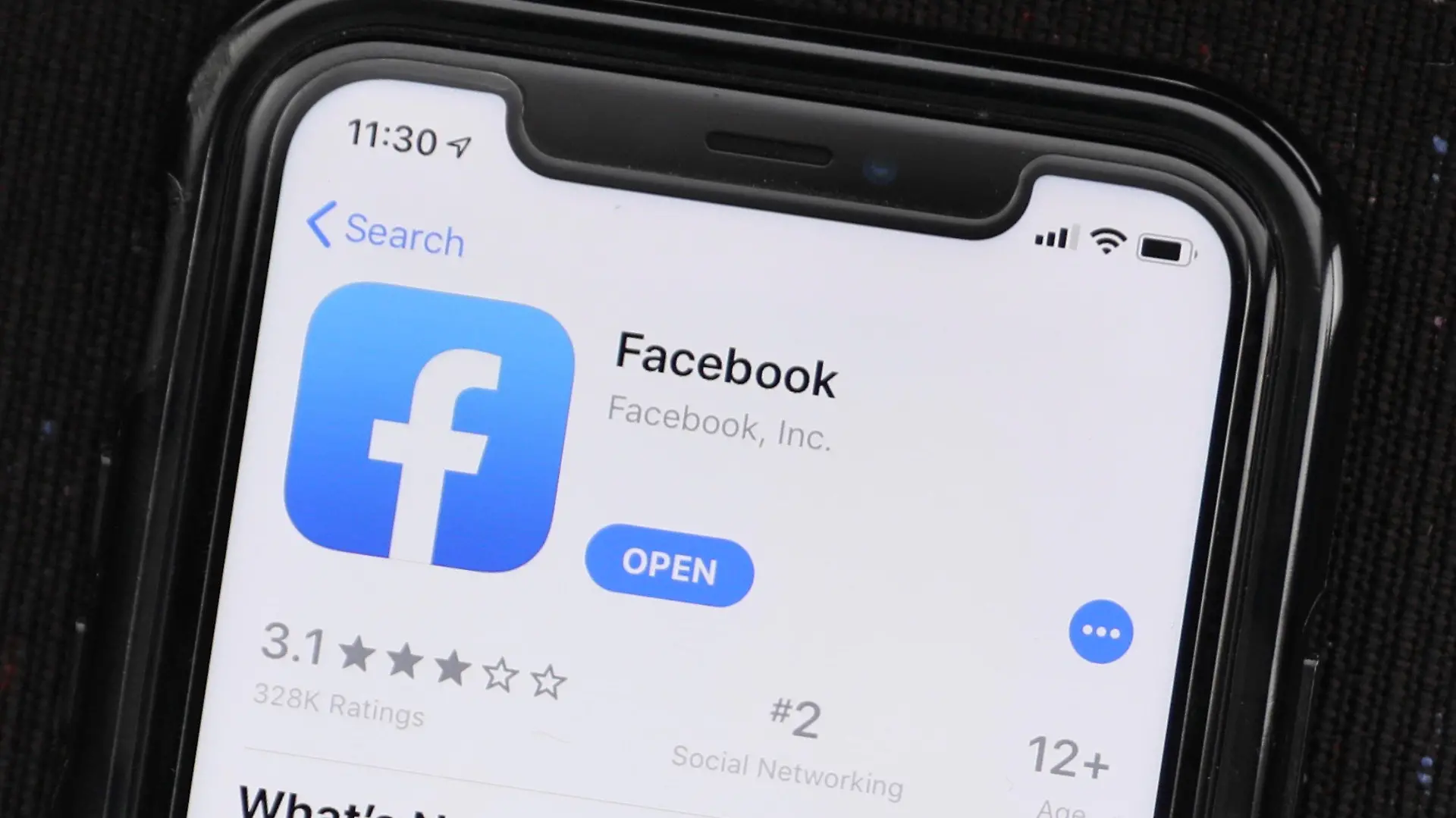 FILE - In this July 30, 2019, file photo, the social media application, Facebook is displayed on Apple's App Store in Chicago, Ill. The social media company said Thursday, April 16, 2020, it is now going to let users know if they liked, reacted or commented on posts with harmful misinformation about the coronavirus that moderators later removed. Facebook says it will also direct people who engaged with those posts to information about virus myths debunked by the World Health Organization. (AP Photo/Amr Alfiky, File)