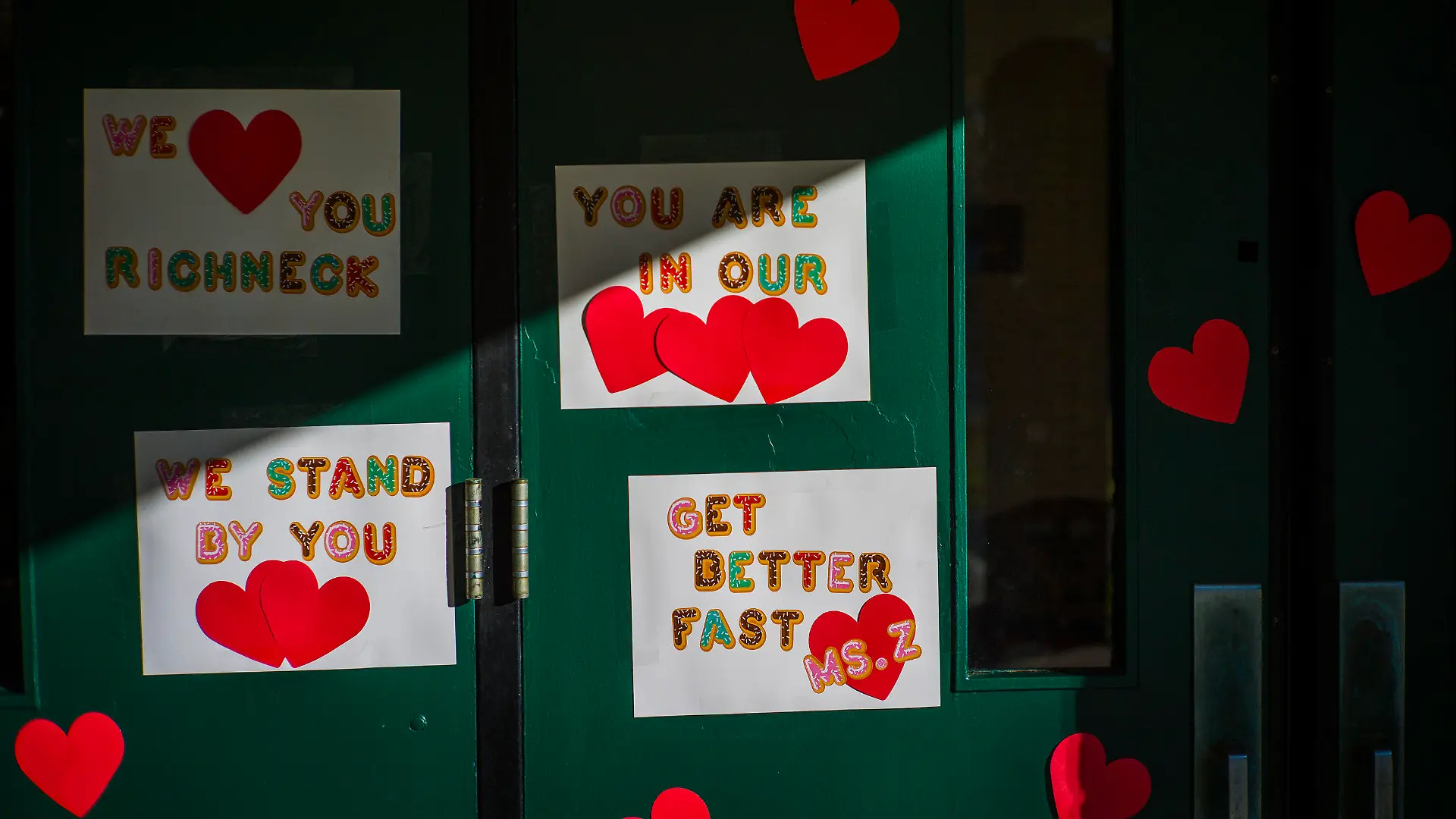 FILE - Messages of support for teacher Abby Zwerner, who was shot by a 6-year-old student, grace the front door of Richneck Elementary School Newport News, Va. on Jan. 9, 2023. Zwerner said Monday, March 20, that she has had four surgeries and has gone through a challenging recovery. (AP Photo/John C. Clark, File)
