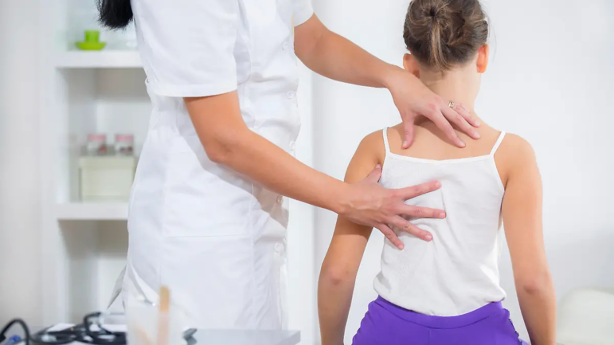 Chiropractic Doctor Adjusts Elementary Girl