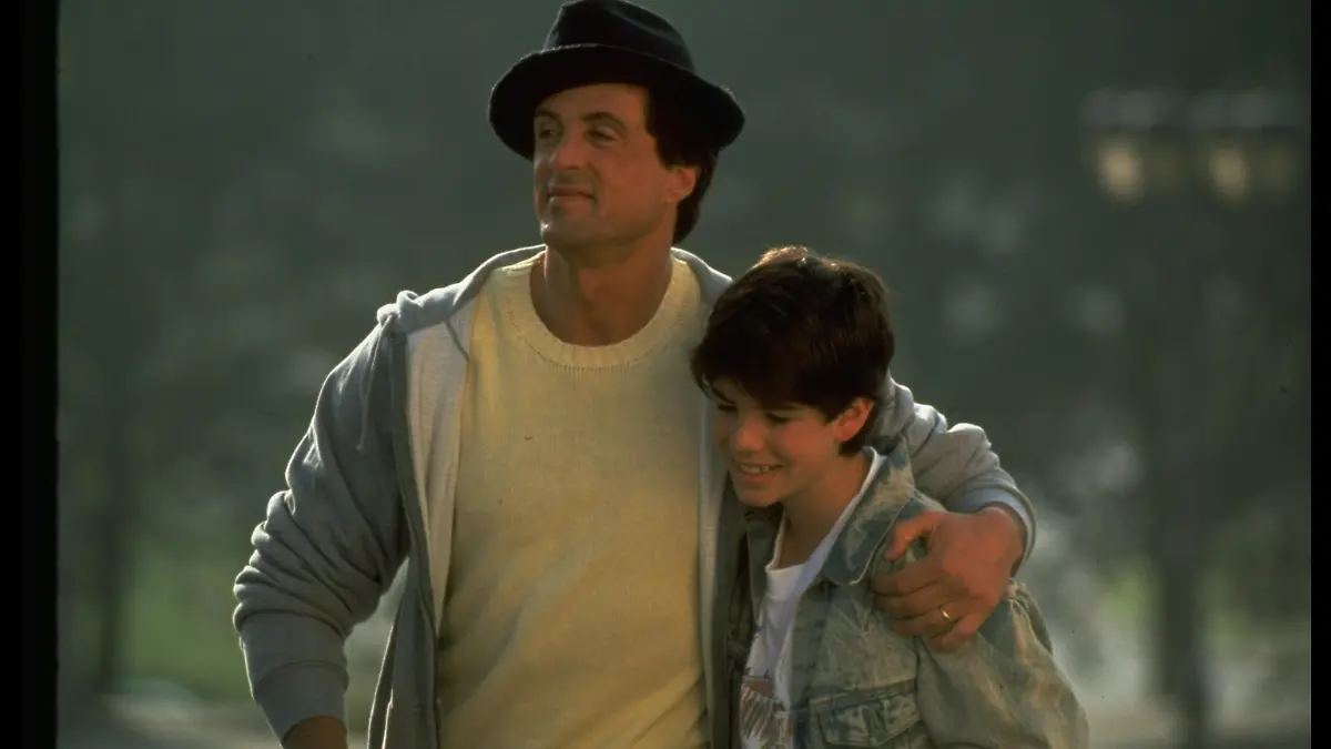 Actor Sylvester Stallone w. arm around son, Sage, in scene fr. motion picture Rocky V.. (Photo by John Bryson/Getty Images)