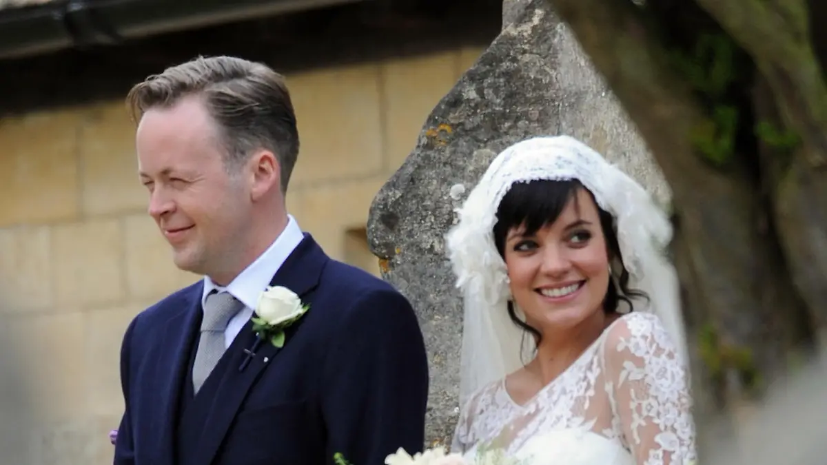 Lily Allen married her builder boyfriend Sam Cooper in an intimate ceremony near their Cotswold Estate. Sam broke the news to close family and friends, at their wedding breakfast, that Lily was pregnant. The traditional service was conducted by Canon Michael Irving at Saint James the Great Church in Cranham, and didn't include the words 'to obey'.  Lily looked radiant wearing a  Chanel 1920's style lace  Delphine Manivet creation and was greeted by well wishers from their tiny village of Cranham.
