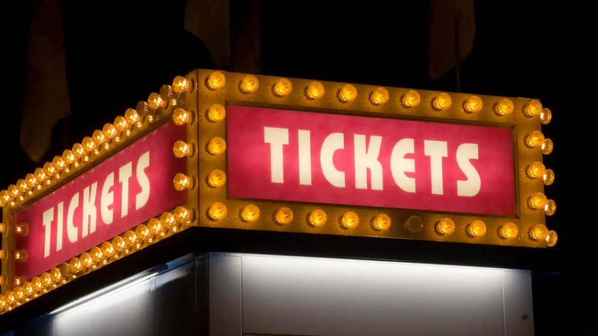 A ticket sign at night