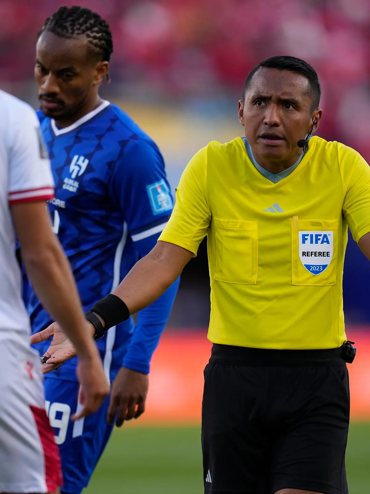 Referee Ivan Barton gestures during the FIFA Club World Cup second round soccer match between Wydad AC and Al Hilal SFC at Prince Moulay Abdellah stadium in Rabat, Morocco, Saturday, Feb. 4, 2023. (AP Photo/Manu Fernandez)