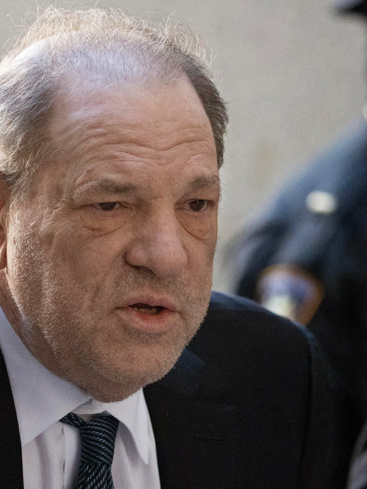 FILE - In this Feb. 21, 2020 file photo, Harvey Weinstein arrives at a Manhattan court as jury deliberations continue in his rape trial in New York. On Wednesday, March 18, the disgraced film mogul was transferred from New York City's notorious Rikers Island jail complex to the to the maximum security Wende Correctional Facility near Buffalo, N.Y. (AP Photo/Mark Lennihan, File)