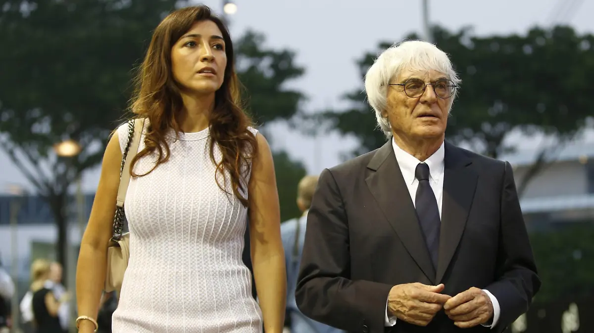 Marina Bay Circuit, Singapore. Thursday 18 September 2014. Bernie Ecclestone, CEO and President, FOM and Fabiana Flosi. World 89P3003 PUBLICATIONxINxGERxSUIxAUTxHUNxONLY