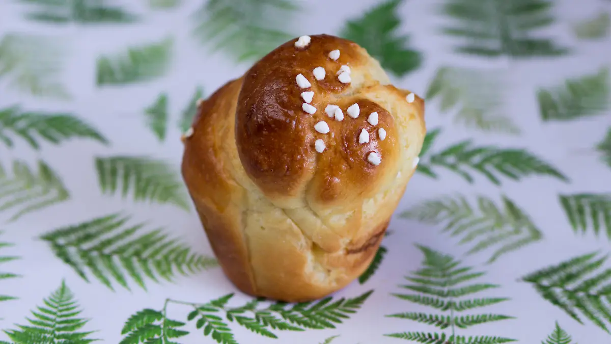A mini brioche on vintage tablecloth