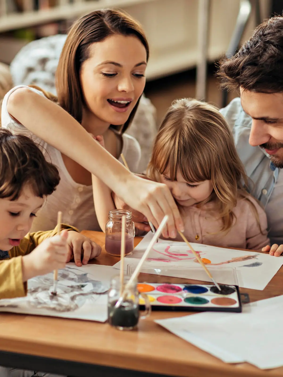 Playful family painting together