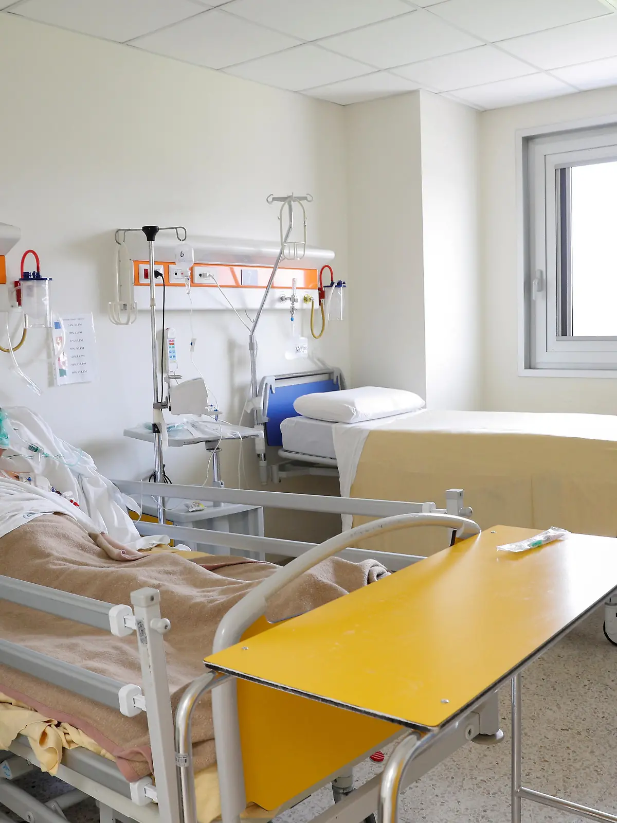 FILE PHOTO: A patient suffering from the coronoavirus disease (COVID-19) is seen at the San Filippo Neri hospital in Rome, Italy, March 30, 2020. REUTERS/Guglielmo Mangiapane/File Photo