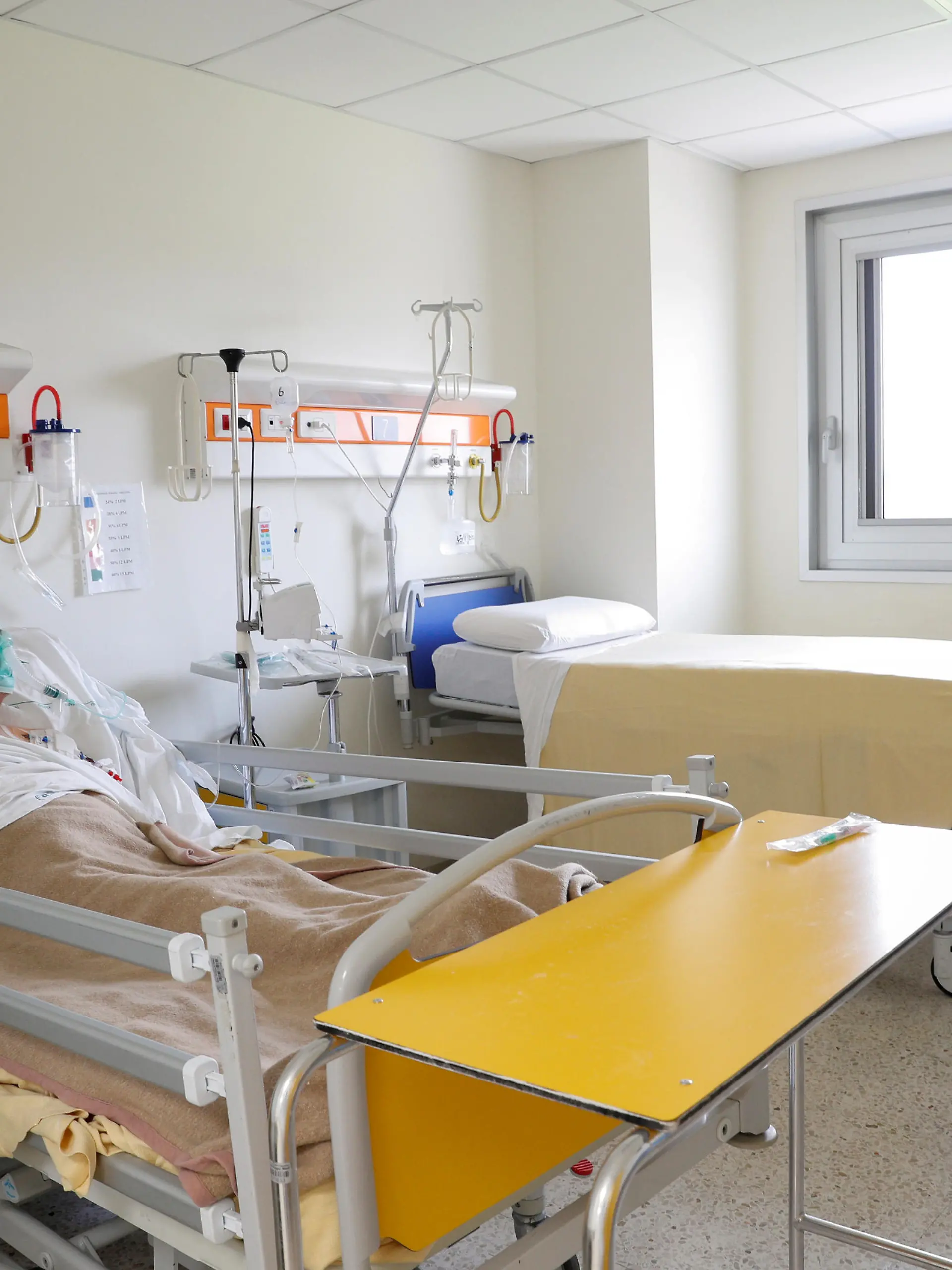 FILE PHOTO: A patient suffering from the coronoavirus disease (COVID-19) is seen at the San Filippo Neri hospital in Rome, Italy, March 30, 2020. REUTERS/Guglielmo Mangiapane/File Photo