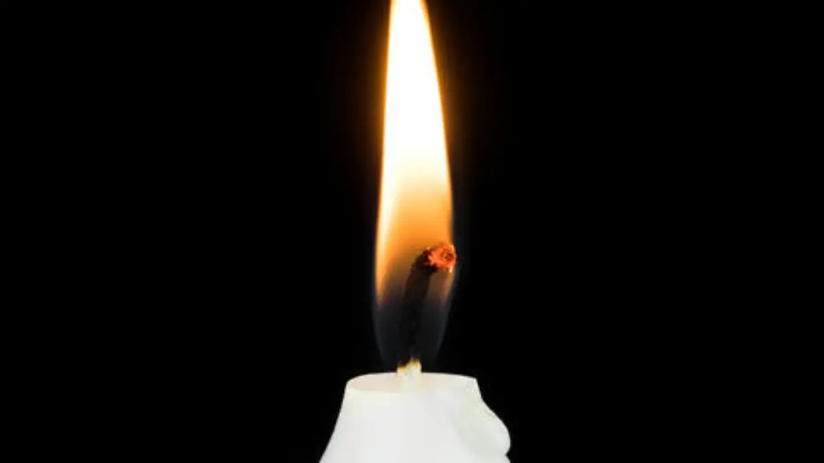 White Burning Candle, festive symbol with black background