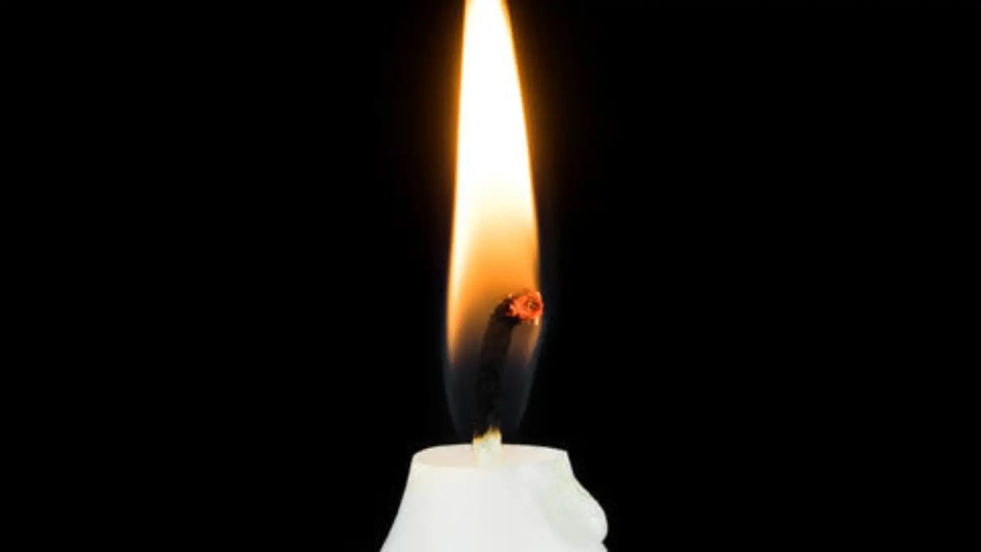 White Burning Candle, festive symbol with black background