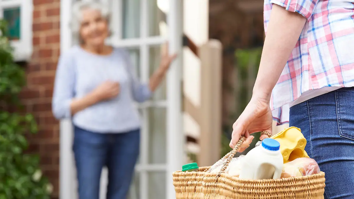 Person Doing Shopping For Elderly Neighbour
