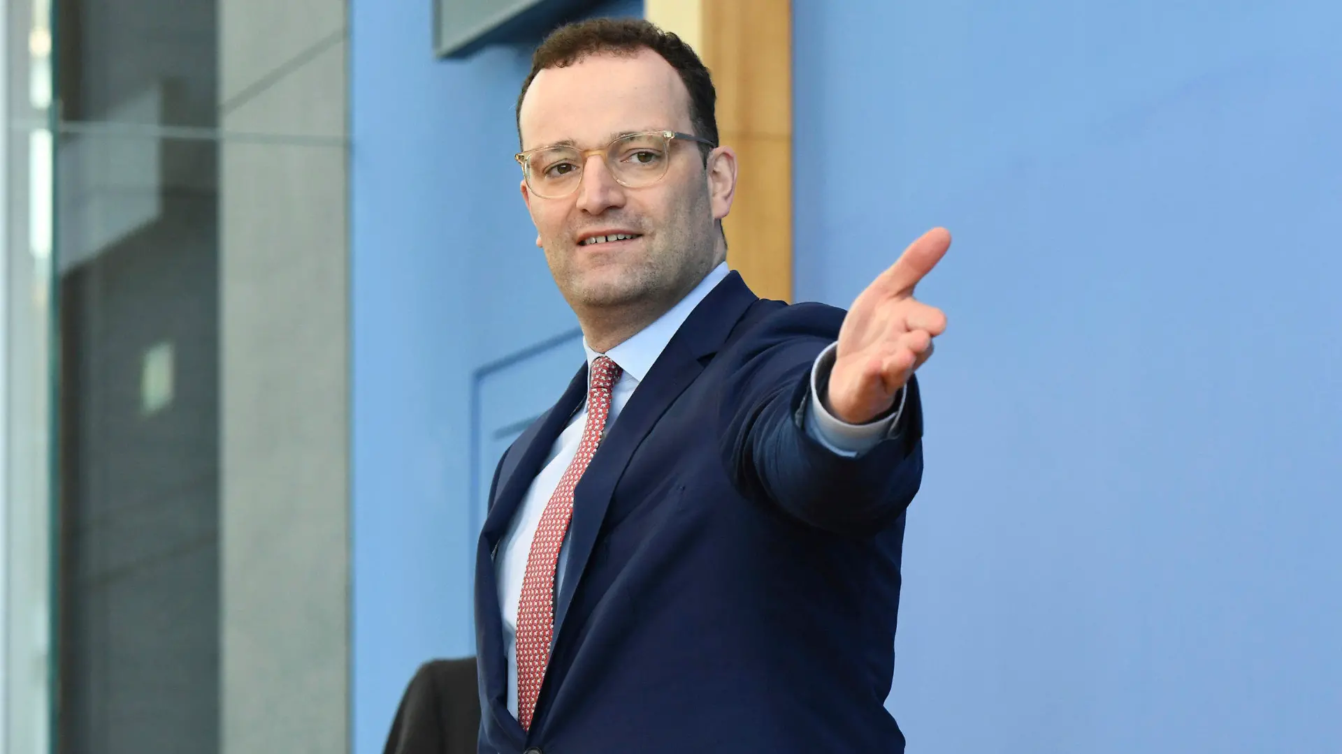 German Health Minister Jens Spahn arrives for a news conference about the spread of coronavirus disease in Berlin, Germany, Thursday, March 26, 2020. The new coronavirus causes mild or moderate symptoms for most people, but for some, especially older adults and people with existing health problems, it can cause more severe illness or death. (Annegret Hilse/Pool via AP)