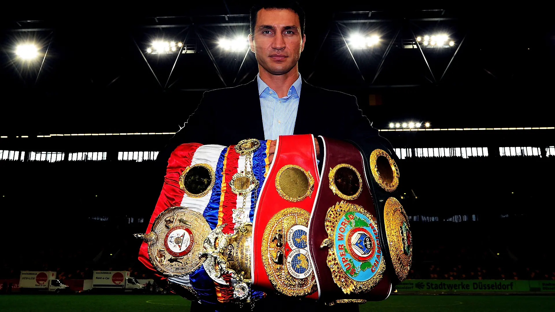 DUESSELDORF, GERMANY - OCTOBER 12: Wladimir Klitschko of Ukraine pose with his championship belts after a press conference at Esprit-Arena on October 12, 2011 in Duesseldorf, Germany. The WBO, WBA, IBF and IBO heavy weight titel fight between Wladimir Klitschko of Ukraine and Jean-Marc Mormeck of France will be held on the 10th of December 2011 at Esprit-Arena in Duesseldorf. (Photo by Lars Baron/Bongarts/Getty Images)