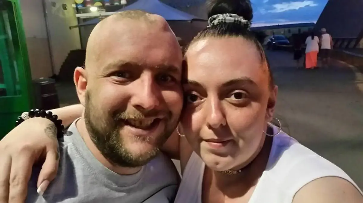 Story from Jam Press (Cancer Wedding)

Pictured: Kirsty and Wayne.

‘My husband is starting to forget us – we’ve only got months before his tumour tears our family apart,' says devastated mum

A woman has shared the heartbreak of her “soulmate” being given just three months to live – and says he’s already starting to forget his family.

A few months ago, Kirsty Chorlton was left devastated as she asked her husband, Wayne, about their wedding day and he couldn’t recall any details about the special event.

The loss of his memories is the latest tragic symptom to hit the dad-of-two, who has a butterfly glioma, a rare tumour that is slowly eating away at his brain.

Wife Kirsty, 34, is now sharing their story to raise awareness and funds so they can make memories together with their daughters, Daisy-Marie and Evie, aged four and two, having recently renewed their vows to give her husband, aged 37, new memories of their wedding.

“Hearing that the love of my life has cancer was my worst fear coming true,” the mum, who is a full-time carer from Porth, Wales, told NeedToKnow.Online.

“Actually being told the news broke me but my first reaction was that he was going to die and I was going to lose him.

“Now, we’ve been left completely devastated as a family, as his memory has gone really bad and he can’t remember much of his daily routine or big life moments.

“I wouldn’t wish this on my worst enemy and I can’t believe this is happening.

“Wayne is [so young] and we should have the rest of our lives together, it doesn't feel real knowing I’ll have to one day bury my soulmate, the father of my children.

“I’m scared to death of the unknown, but our vow renewal was the best day ever.

"It was so nice to go out and enjoy our day, while forgetting about everything for a while – but most importantly, Wayne really loved the day."

Kirsty and Wayne started their love story back in April 2010, feeling an instant connection – and just e