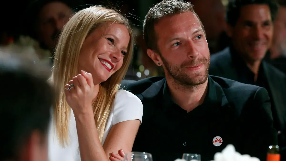 FILE - This Jan. 11, 2014 file photo shows actress Gwyneth Paltrow, left, and her husband, singer Chris Martin at the 3rd Annual Sean Penn & Friends Help Haiti Home Gala in Beverly Hills, Calif. Paltrow and Martin are separating after 11 years of marriage. A message posed on the 41-year-old actress' blog Tuesday, March 25, says that the couple has "come to the conclusion that while we love each other very much we will remain separate." Paltrow and the 37-year-old musician married in 2003. The couple has two children, 9-year-old daughter Apple and 7-year-old son Moses. (Photo by Colin Young-Wolff /Invision/AP, File)