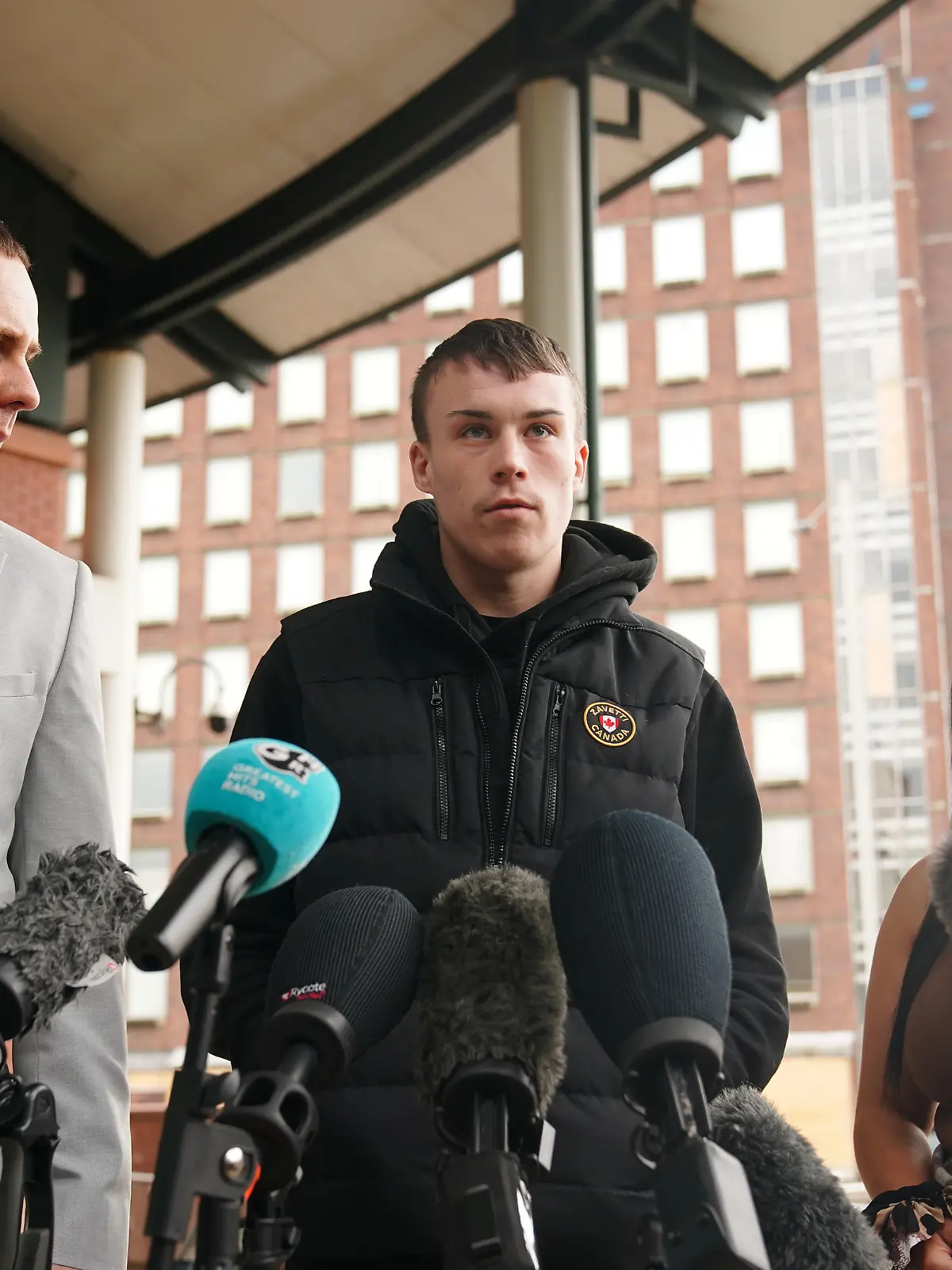 Eleanor Williams court case. Jordan Trengove (centre), who was accused of trafficking by Eleanor Williams, speaking to the media outside Preston Crown Court, Lancashire, where she was jailed for eight-and-a-half years for nine counts of perverting the course of justice after she claimed to have been the victim of an Asian grooming gang. Williams, 22, published pictures of her injuries and an account of being groomed, trafficked and beaten, on Facebook in May 2020, in a post which was shared more than 100,000 times. Picture date: Tuesday March 14, 2023. See PA story COURTS Williams. Photo credit should read: Peter Byrne/PA Wire URN:71373665