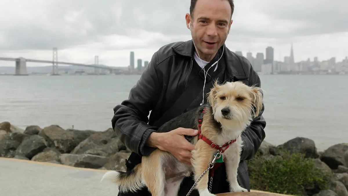 This May 16, 2011 photo shows Timothy Ray Brown, the only man ever known to have been apparently cured from AIDS, with his dog, Jack, on Treasure Island in San Francisco. Brown was in a Berlin hospital in 2007, worrying whether leukemia or the AIDS virus would do him in, when his German doctor said he had an "off the wall" idea for tackling both. The unusual blood transplant they tried has made Brown the first person in the world apparently cured of AIDS. (AP Photo/Eric Risberg)