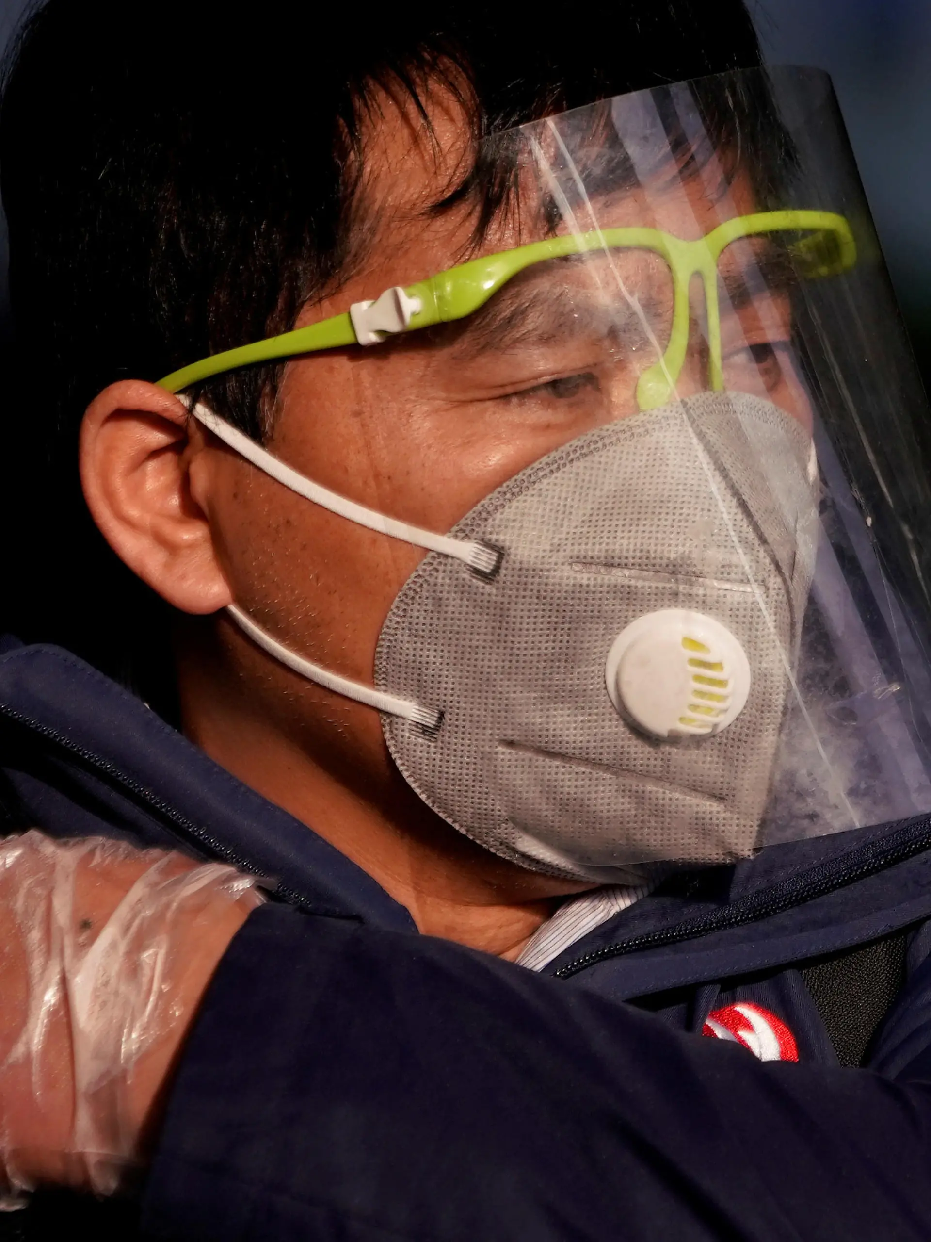 FILE PHOTO: A man wearing a mask is seen at the Shanghai railway station in Shanghai, China, as the country is hit by an outbreak of the novel coronavirus, February 12, 2020. REUTERS/Aly Song/File Photo