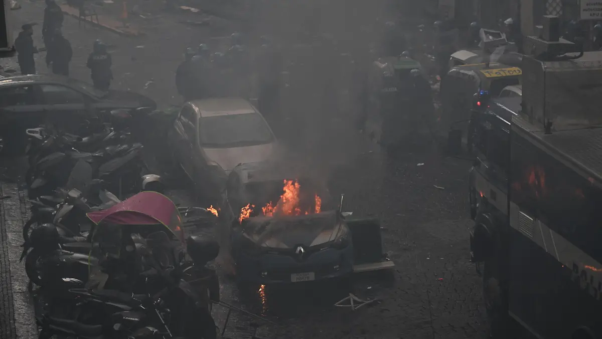 March 15, 2023, NAPLES: Police car set on fire during clashes with Eintracht Frankfurt s supporters in Naples, Italy, 15 March 2023. Napolis and Eintracht Frankfurt will play the UEFA Champions League round of 16 second leg soccer match at the Diego Armando Maradona stadium in Naples..ANSA/CIRO FUSCO NAPLES PUBLICATIONxINxGERxSUIxAUTxONLY - ZUMAa110 20230315_zaf_a110_019 Copyright: xCiroxFuscox