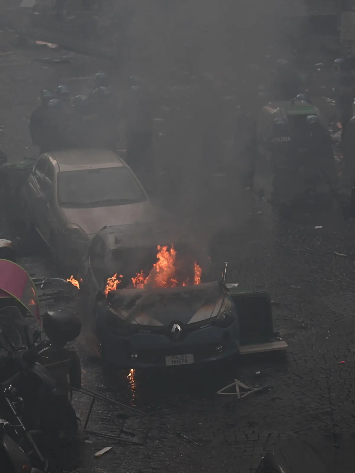 March 15, 2023, NAPLES: Police car set on fire during clashes with Eintracht Frankfurt s supporters in Naples, Italy, 15 March 2023. Napolis and Eintracht Frankfurt will play the UEFA Champions League round of 16 second leg soccer match at the Diego Armando Maradona stadium in Naples..ANSA/CIRO FUSCO NAPLES PUBLICATIONxINxGERxSUIxAUTxONLY - ZUMAa110 20230315_zaf_a110_019 Copyright: xCiroxFuscox