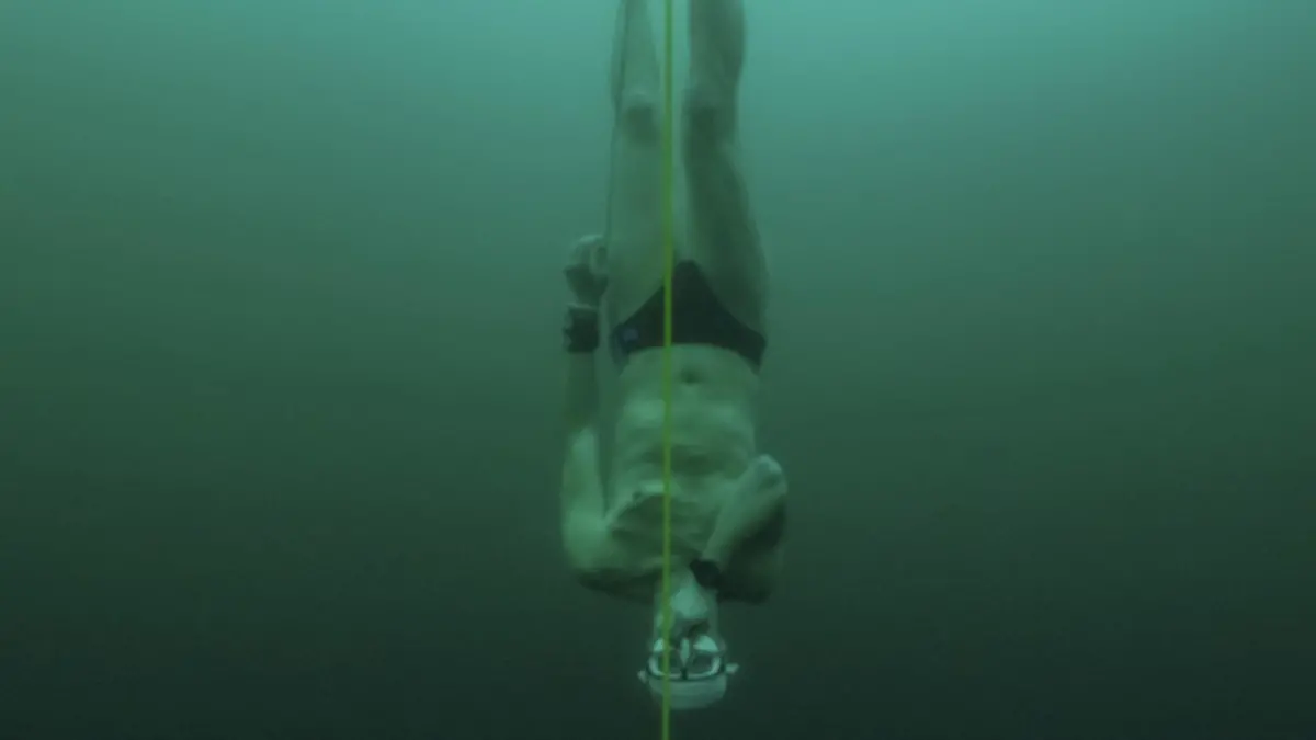 Czech freediver David Vencl dives to 52 metres under the ice of Lake Sils in one breath and wearing only a swimsuit in this picture taken from a video in Sils near St. Moritz, Switzerland March 14, 2023. David Vencl Organisation/Handout via REUTERS THIS IMAGE HAS BEEN SUPPLIED BY A THIRD PARTY. NO RESALES. NO ARCHIVES