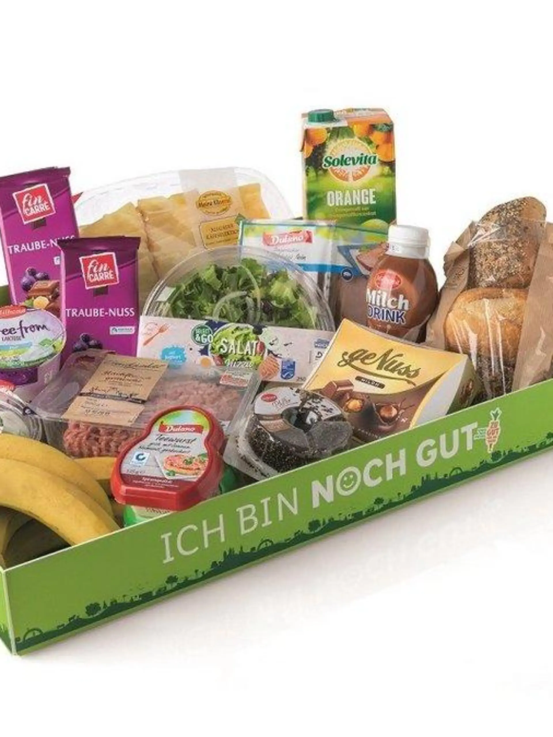 Flache, grüne Pappbox mit der Aufschrift: Ich bin noch gut. Pappbox enthält Bananen, Joghurt, Brötchen und Schokolade.