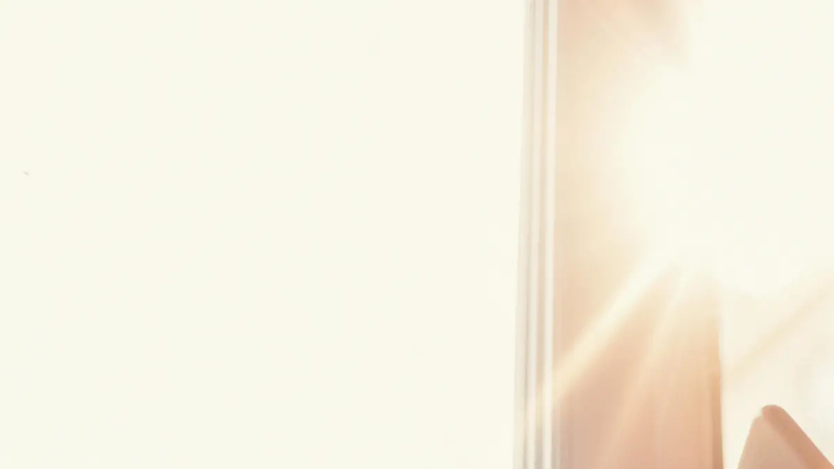 Smiling woman using smartphone and drinking coffee in the morning
