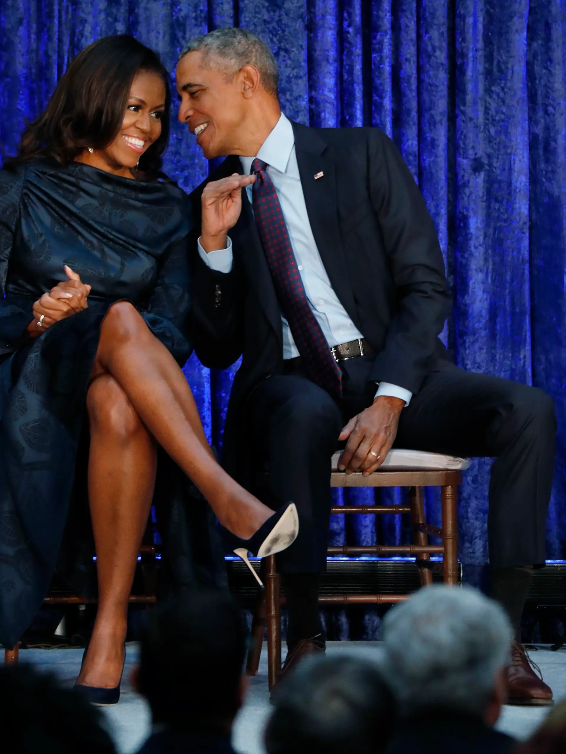 Former U.S. President Barack Obama sits with former first lady Michelle Obama prior to the the unveiling of their portraits at the Smithsonian’s National Portrait Gallery in Washington, U.S., February 12, 2018. REUTERS/Jim Bourg