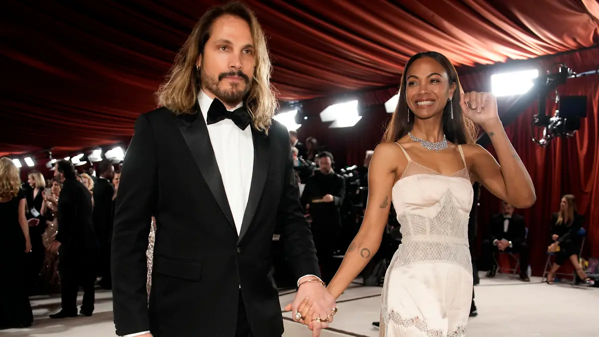 Marco Perego Saldana, left, and Zoe Saldana arrive at the Oscars on Sunday, March 12, 2023, at the Dolby Theatre in Los Angeles. (AP Photo/John Locher)