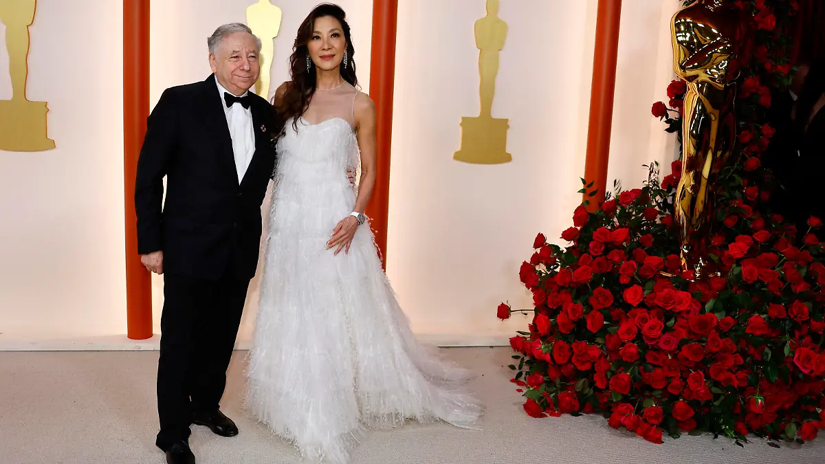 Michelle Yeoh and Jean Todt pose on the champagne-colored red carpet during the Oscars arrivals at the 95th Academy Awards in Hollywood, Los Angeles, California, U.S., March 12, 2023. REUTERS/Eric Gaillard
