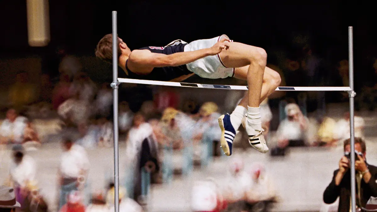 FILE - Dick Fosbury, of the United States, clears the bar in the high jump competition at the 1968 Mexico City Olympics. Fosbury, the lanky leaper who completely revamped the technical discipline of high jump and won an Olympic gold medal with his “Fosbury Flop,” has died after a recurrence with lymphoma. Fosbury died Sunday, March 12, 2023, according to his publicist, Ray Schulte. He was 76. (AP Photo/File)