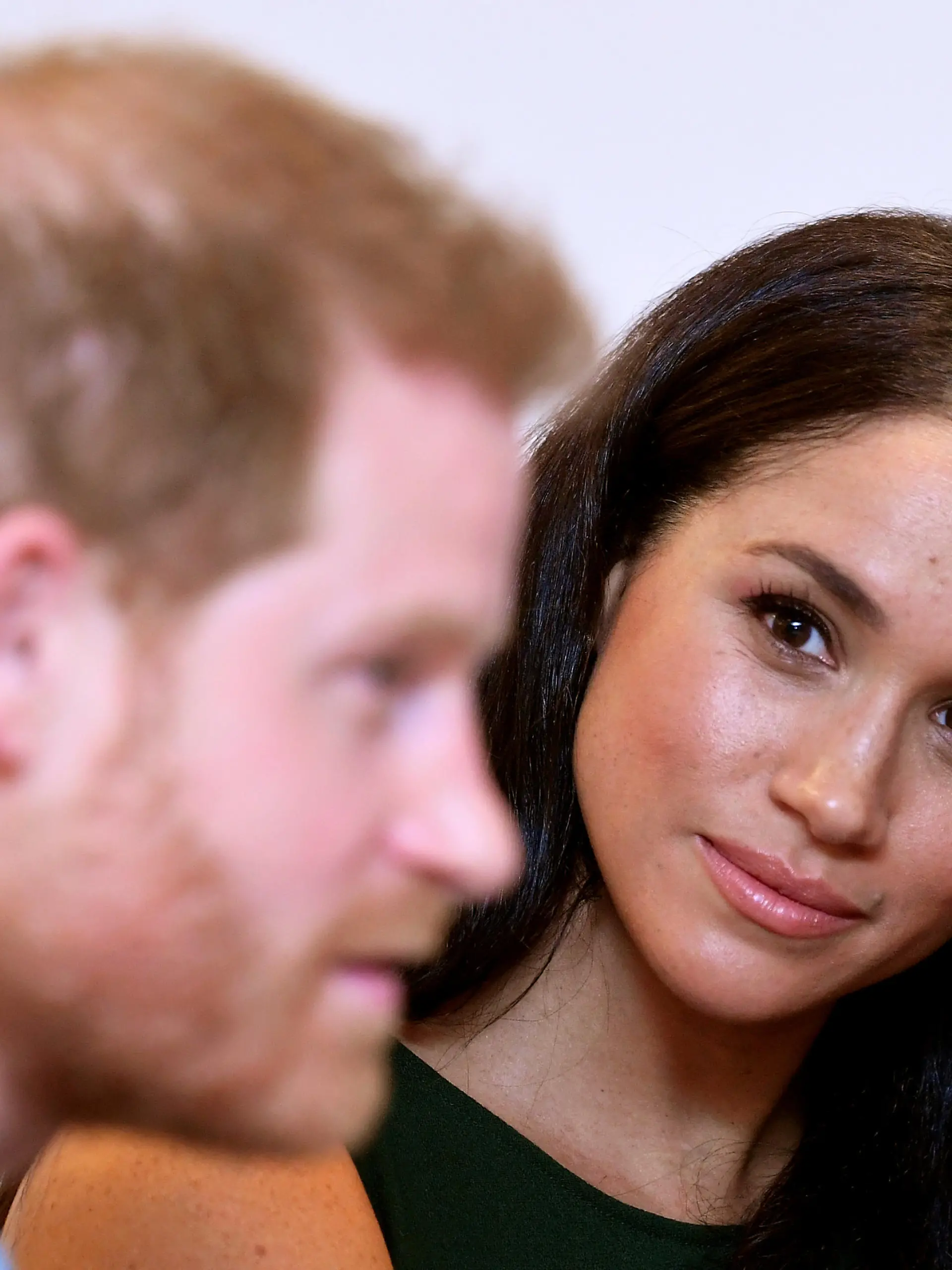 FILE PHOTO: Meghan, Duchess of Sussex, looks at Britain's Prince Harry during the WellChild Awards pre-Ceremony reception in London, Britain, October 15, 2019. REUTERS/Toby Melville/Pool/File Photo