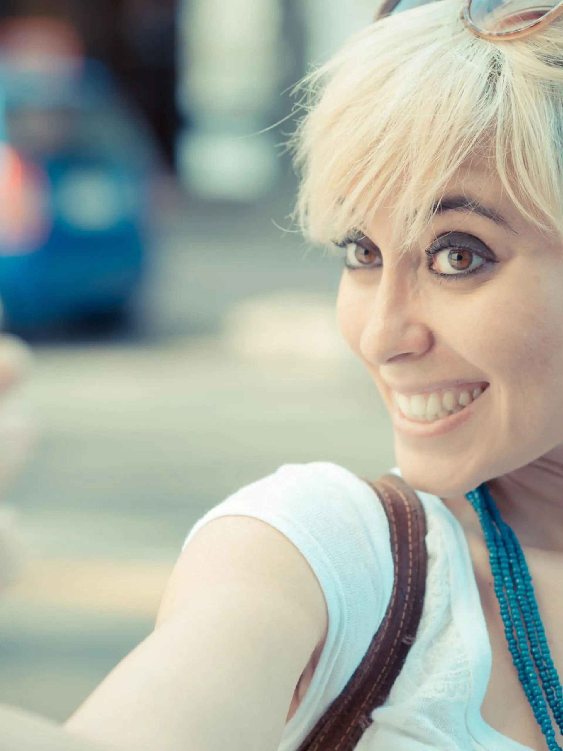 beautiful young blonde short hair hipster woman selfie in the city
