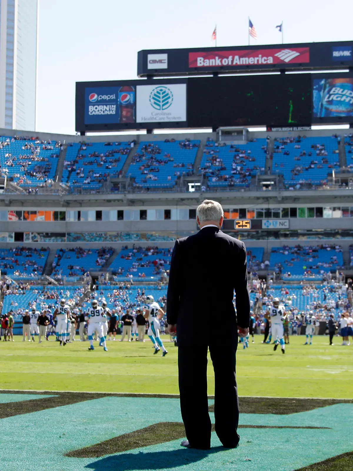 FILE - Carolina Panthers owner Jerry Richardson looks on as his team warms up before an NFL football game against the New York Giants in Charlotte, N.C., Sunday, Sept. 22, 2013. Richardson, the Panthers founder and for years one of the NFL’s most influential owners until a scandal forced him to sell the team, died peacefully Wednesday night, March 1, 2023, at his Charlotte home, the team said in a statement. He was 86. (AP Photo/Bob Leverone, File)