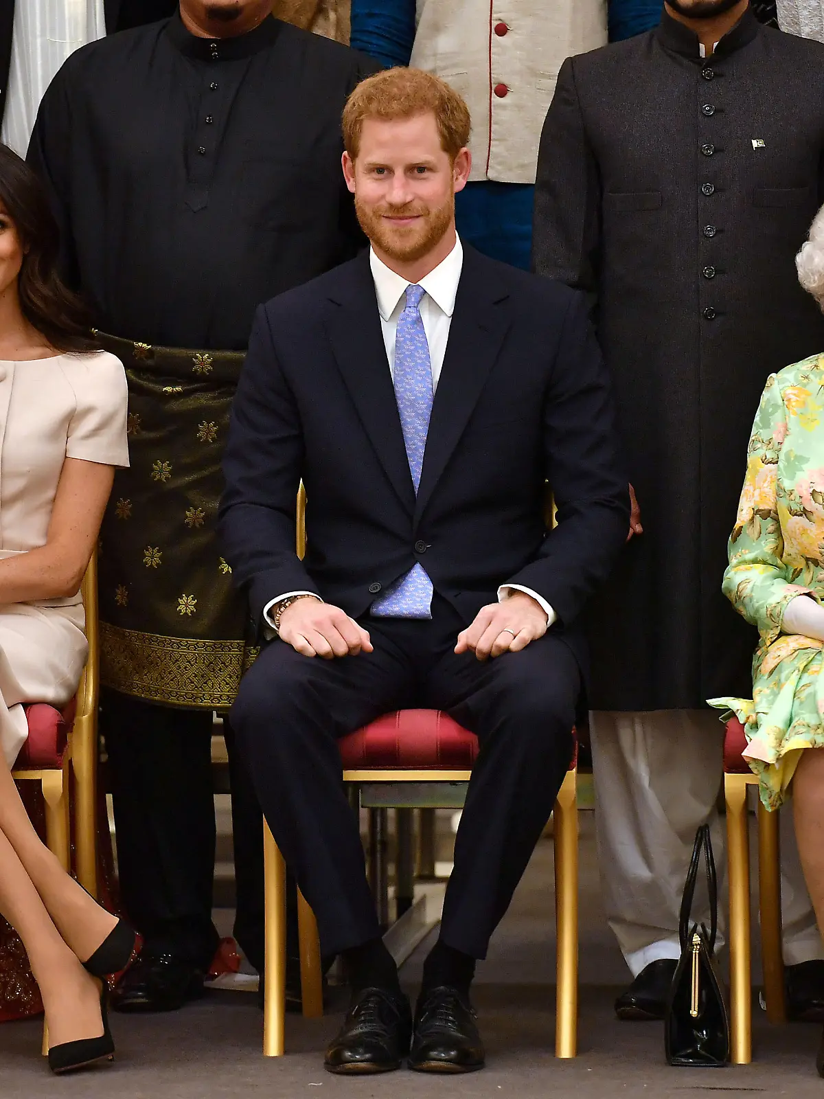 FILE PHOTO: Britain's Queen Elizabeth, Prince Harry and Meghan, the Duchess of Sussex, pose for a picture at in London, Britain June 26, 2018. John Stillwell/Pool via Reuters/File Photo