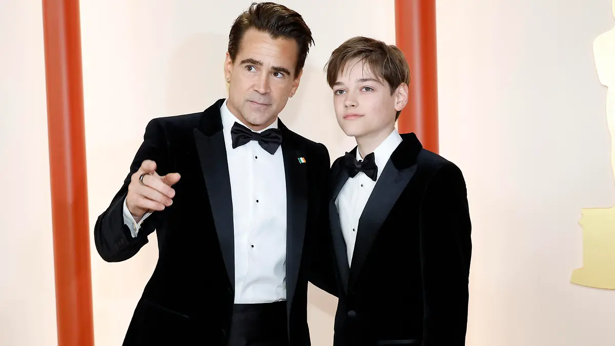 HOLLYWOOD, CALIFORNIA - MARCH 12: (L-R) Colin Farrell and Henry Tadeusz attend the 95th Annual Academy Awards on March 12, 2023 in Hollywood, California. (Photo by Mike Coppola/Getty Images)