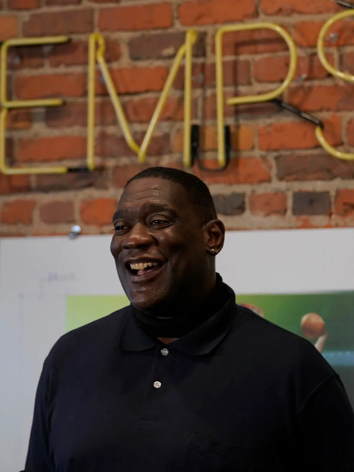 Shawn Kemp, a former NBA basketball player for the Seattle SuperSonics and several other teams, reacts as he talks to reporters about the grand opening of Shawn Kemp's Cannabis, the marijuana dispensary he owns with several business partners, Friday, Oct. 30, 2020, in downtown Seattle. (AP Photo/Ted S. Warren)