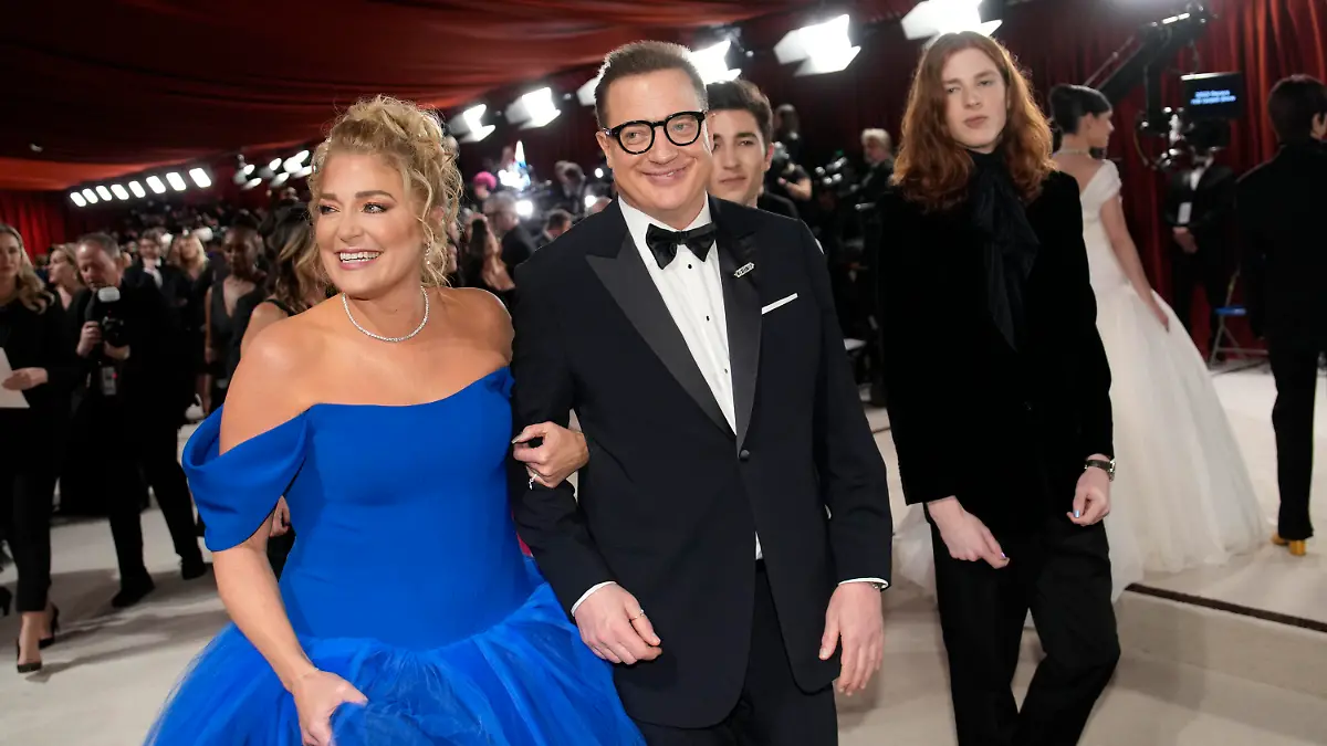 Jeanne Moore, left, and Brendan Fraser arrive at the Oscars on Sunday, March 12, 2023, at the Dolby Theatre in Los Angeles. (AP Photo/John Locher)