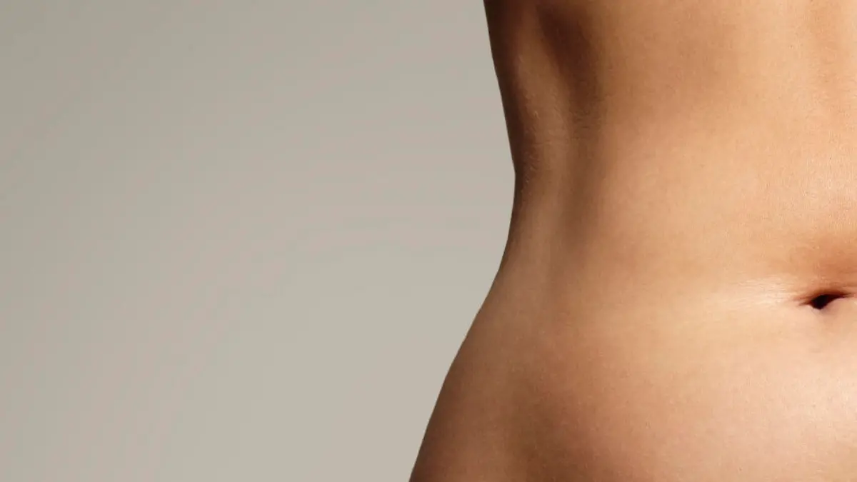 woman pinched her fat on body