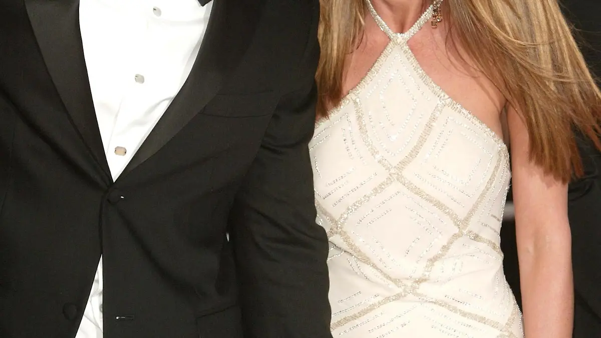 CANNES, FRANCE - MAY 13: Actor Brad Pitt and wife actress Jennifer Aniston attend the World Premiere of the epic movie 'Troy' at Le Palais de Festival on May 13, 2004 in Cannes, France. Aniston wears a dress by Versace. (Photo by Evan Agostini/Getty Images)