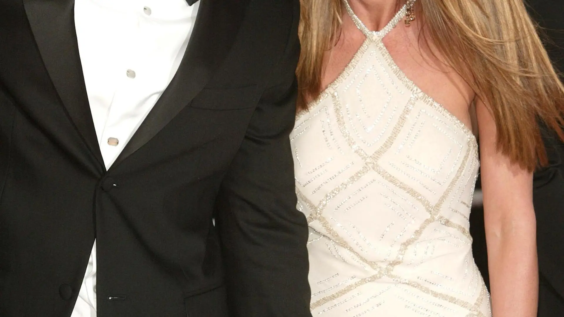 CANNES, FRANCE - MAY 13:  Actor Brad Pitt and wife actress Jennifer Aniston attend the World Premiere of the epic movie 'Troy' at Le Palais de Festival on May 13, 2004 in Cannes, France. Aniston wears a dress by Versace. (Photo by Evan Agostini/Getty Images)