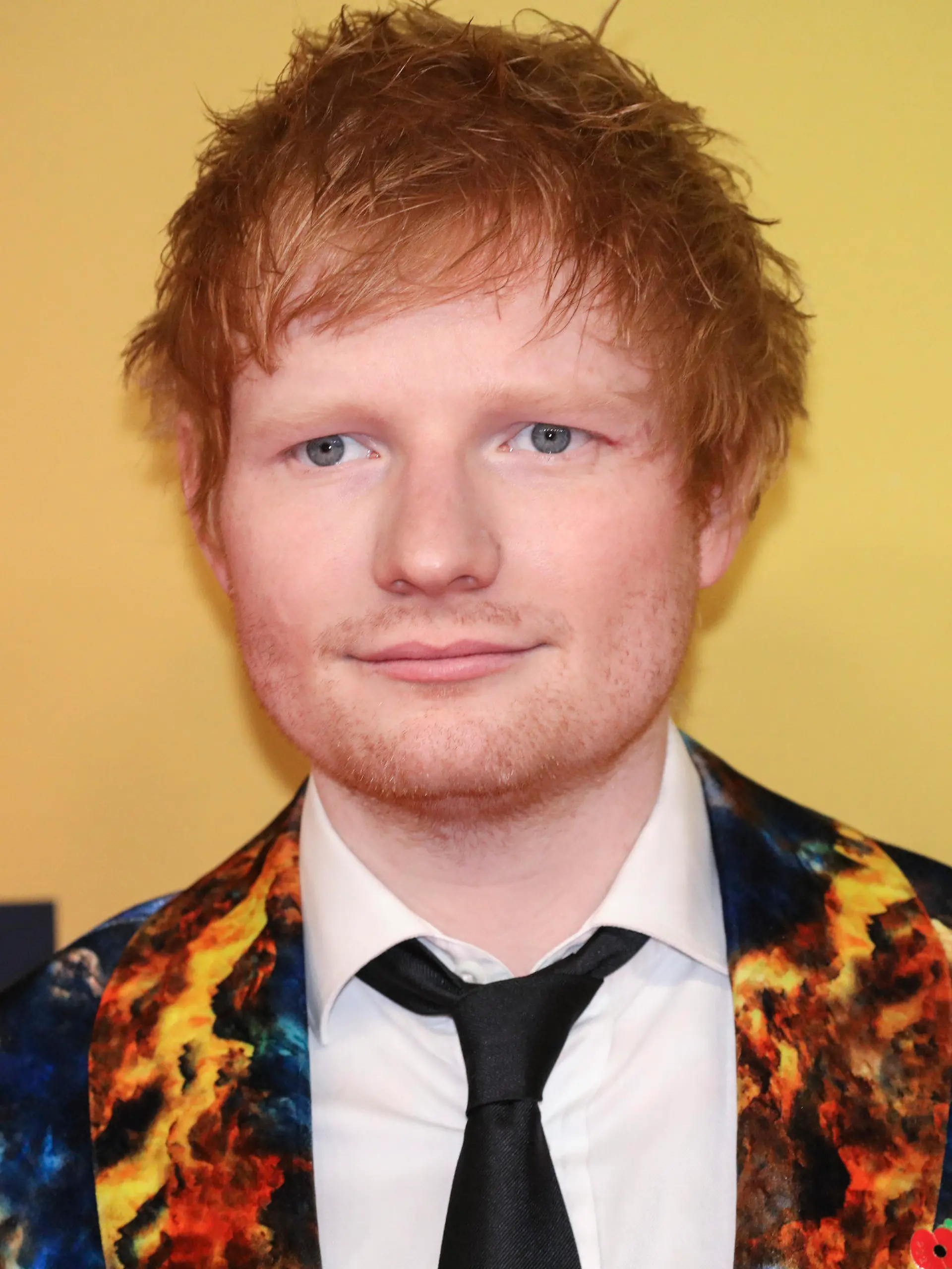 ARCHIV - 14.11.2021, Ungarn, Budapest: Ed Sheeran, Sänger aus Großbritannien, kommt zur Verleihung der MTV Europe Music Awards (EMA) in der Papp Laszlo Budapest Sportarena. (zu dpa «Ed Sheeran über seine Tochter: «Hat mir einen Sinn gegeben») Foto: Vianney Le Caer/Invision/AP/dpa +++ dpa-Bildfunk +++