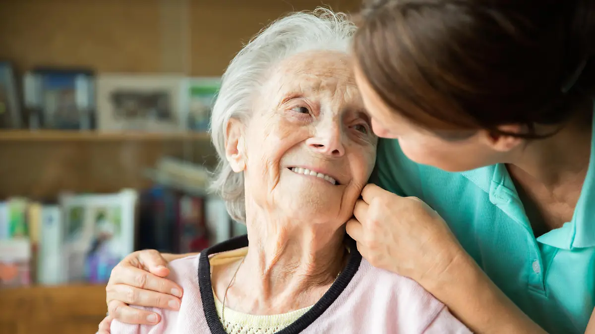 Senior woman with home caregiver