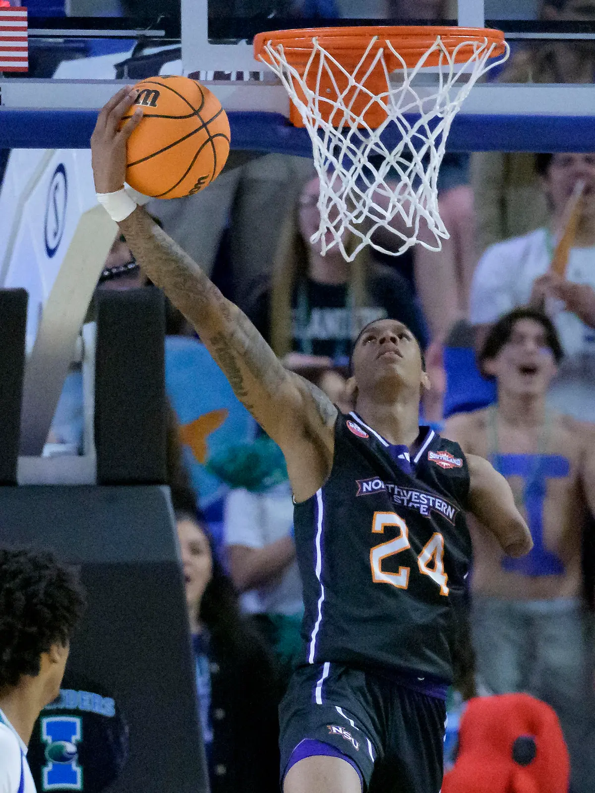 Northwestern State guard Hansel Enmanuel (24) goes up to dunk against Texas A