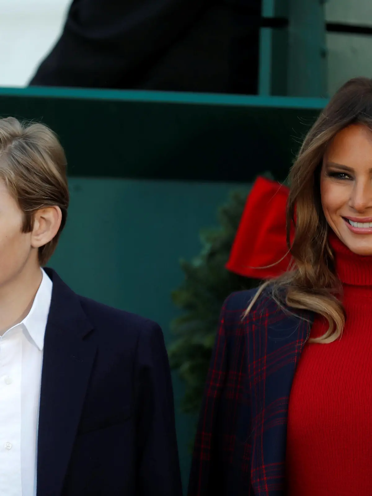 First lady Melania Trump and her son Barron Trump welcome the official White House Christmas Tree, a Wisconsin-grown tree provided by the Chapman family of Silent Night Evergreens, to the White House in Washington DC, U.S. November 20, 2017.  REUTERS/Carlos Barria