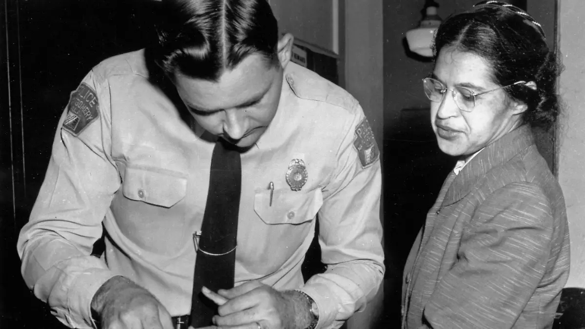 FILE - In this Feb. 22, 1956, file photo, Rosa Parks is fingerprinted by police Lt. D.H. Lackey in Montgomery, Ala., two months after refusing to give up her seat on a bus for a white passenger on Dec. 1, 1955. She was arrested with several others who violated segregation laws. Parks' refusal to give up her seat led to a boycott of buses by blacks in December 1955, a tactic organized by the Rev. Dr. Martin Luther King Jr., which ended after the U.S. Supreme Court deemed that all segregation was unlawful on Dec. 20, 1956. (AP Photo/Gene Herrick, File) |