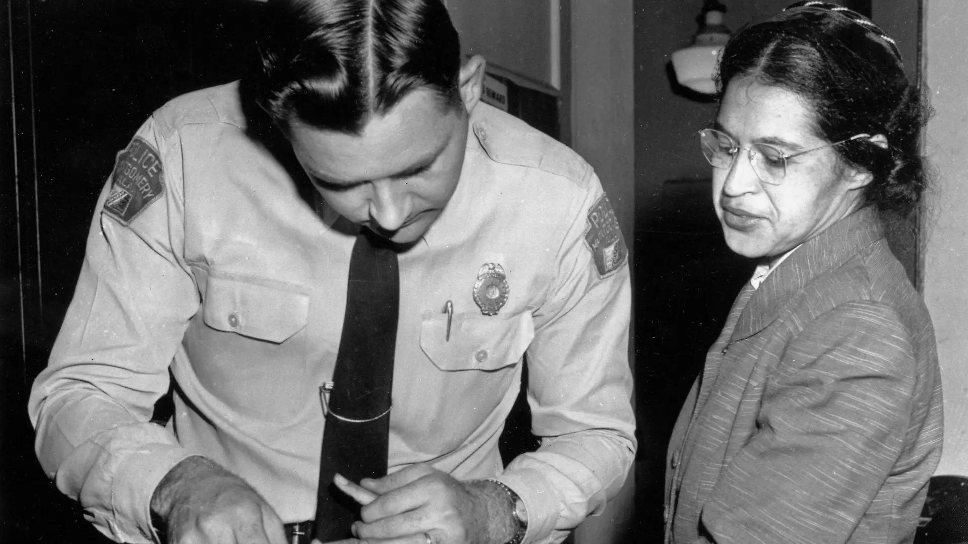 FILE - In this Feb. 22, 1956, file photo, Rosa Parks is fingerprinted by police Lt. D.H. Lackey in Montgomery, Ala., two months after refusing to give up her seat on a bus for a white passenger on Dec. 1, 1955. She was arrested with several others who violated segregation laws. Parks' refusal to give up her seat led to a boycott of buses by blacks in December 1955, a tactic organized by the Rev. Dr. Martin Luther King Jr., which ended after the U.S. Supreme Court deemed that all segregation was unlawful on Dec. 20, 1956. (AP Photo/Gene Herrick, File) |