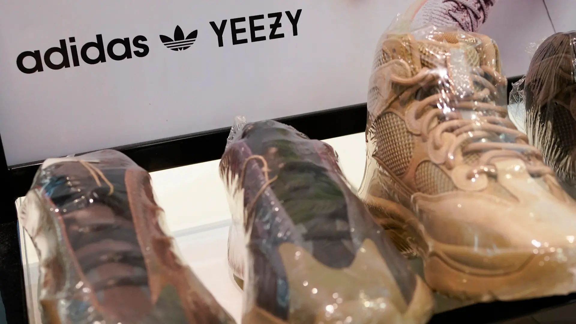 A sign advertises Yeezy shoes made by Adidas at Kickclusive, a sneaker resale store, in Paramus, N.J., Tuesday, Oct. 25, 2022. Adidas has ended its partnership with the rapper formerly known as Kanye West over his offensive and antisemitic remarks, the latest company to cut ties with Ye and a decision that the German sportswear company said would hit its bottom line. (AP Photo/Seth Wenig)